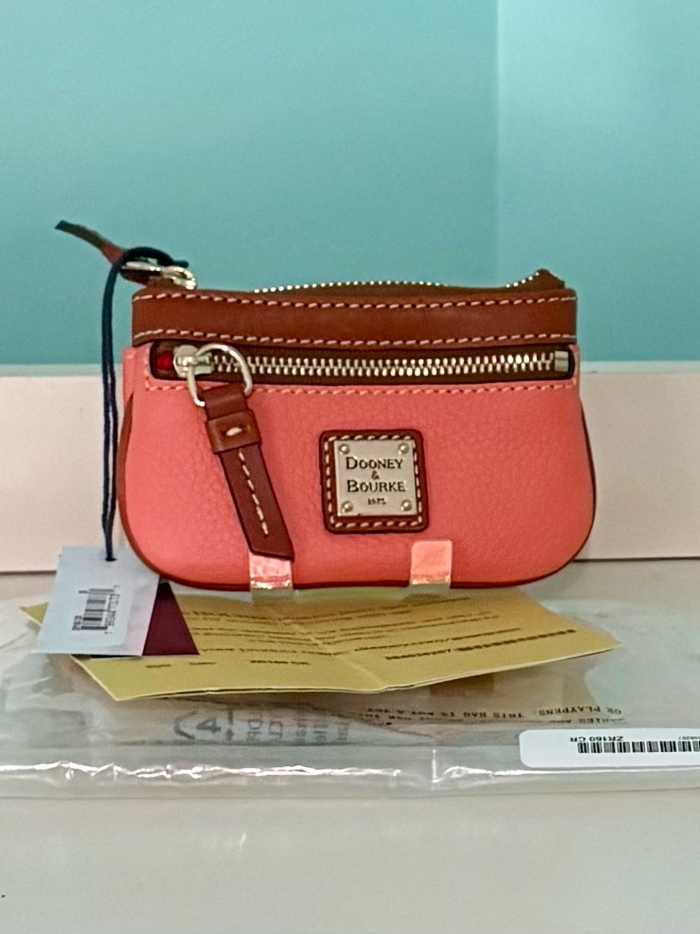 Dooney & Bourke Coral and Brown Leather Coin Pouch
